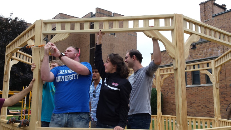 Students and Faculty Helping the Construction of Gazebo