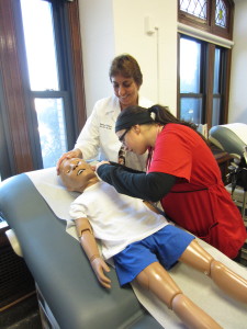 Nursing Students Performing an Analysis on a Human Dummy