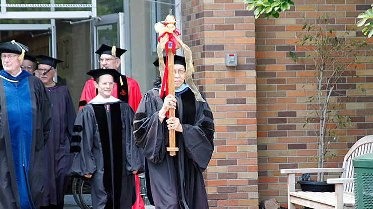 A Faculty Member bearing Ceremonial Mace at Anuual Commencement