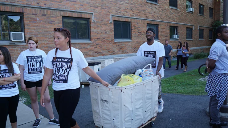 Freshmen moving in the dorm