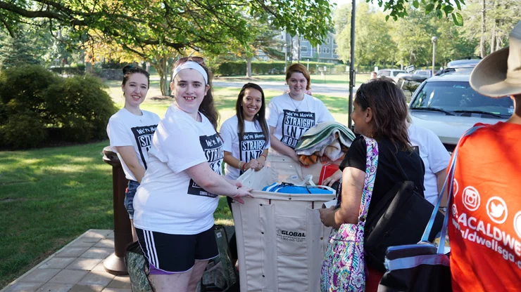 Group of Students helping Freshman on Moving Day