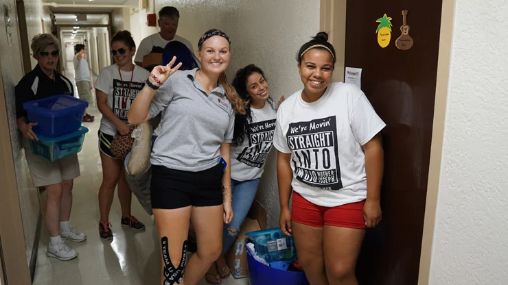 Freshmen moving in the dorm