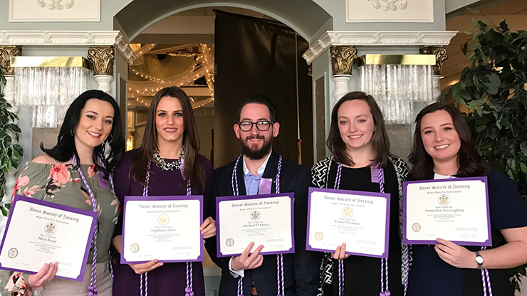 Caldwell University Department of Nursing Students displaying an official charter membership of the international honor society of nursing, Sigma Theta Tau, at a ceremony on March 11 at the Bethwood in Totowa, New Jersey. 