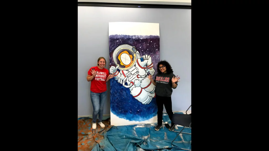 Two Caldwell Student painitng a potrait for ARC of Essex County Stepping Stones School