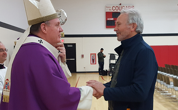 His Eminence Joseph William Cardinal Tobin, C.Ss.R., D.D., Archbishop of the Newark Archdiocese, blessing John DellaPenna, Director, Media/ITV Services of Caldwell University.