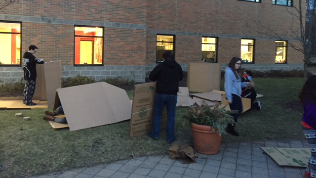 Caldwell University students cleaning up the boxes after sleeping whole night outside to support Campus Ministry project Boxtown aimed at raising awareness about homelessness.