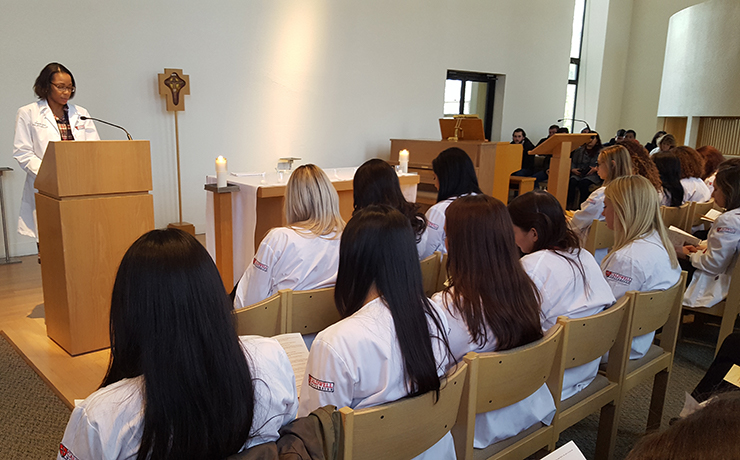 Director of Campus Ministry Colleen O’Brien giving a speech to the Caldwell University junior nursing students.