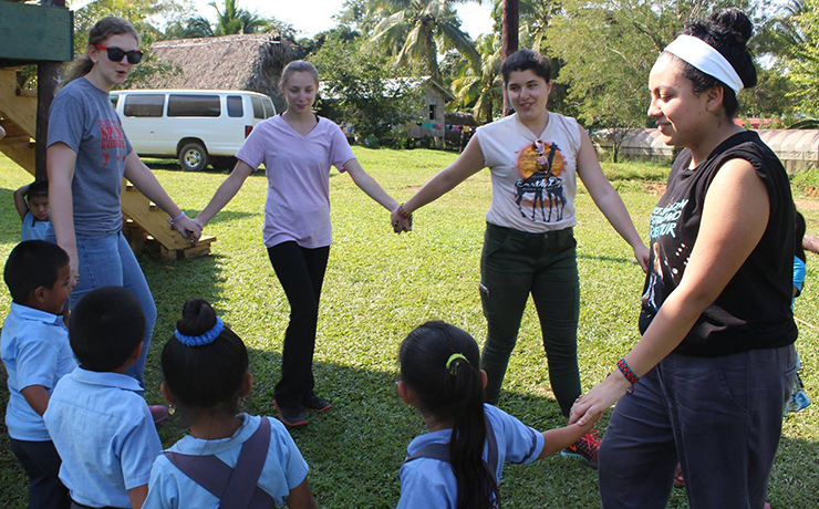 Caldwell University student playing with the kids from the Belize village.