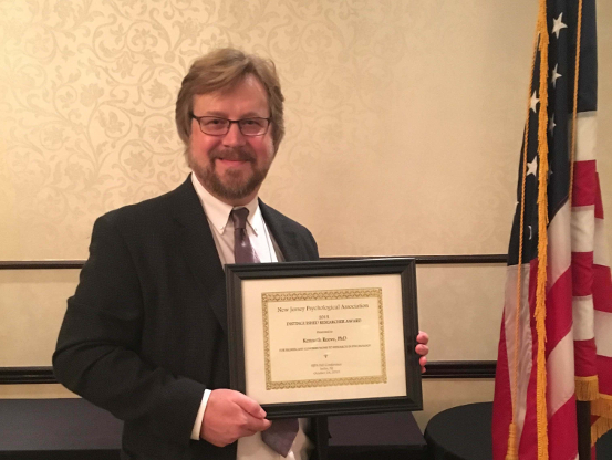 An image of Dr. Kenneth F. Reeve receiving the Distinguished Researcher Award from the New Jersey Psychological Association at its 2015 fall conference at the Woodbridge Hotel in Iselin, New Jersey, on Oct. 24.