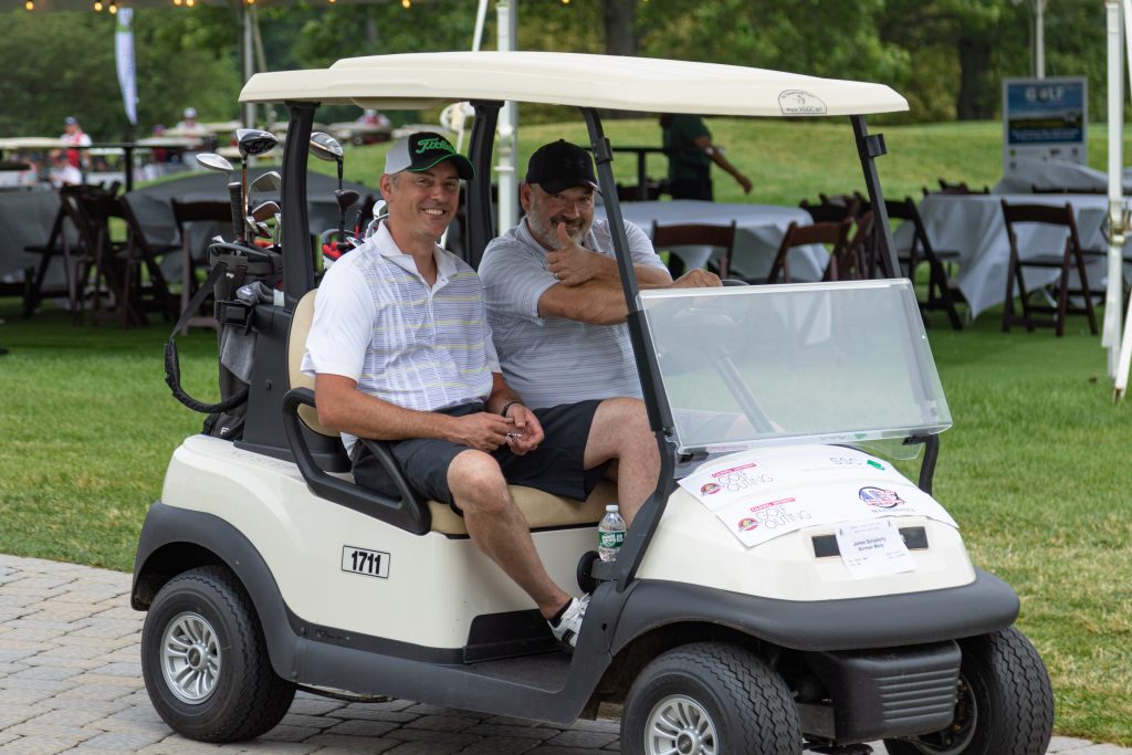 golfers in cart