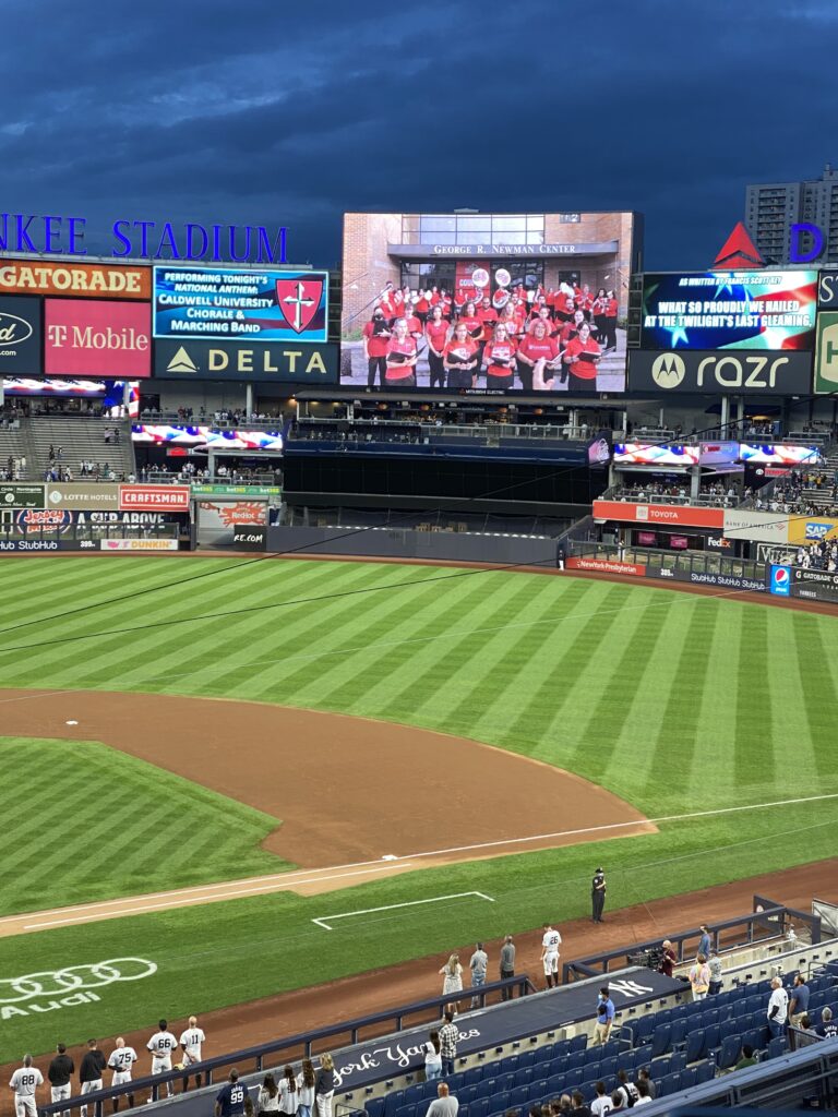 The Caldwell marching band and chorale perform for Yankee fans