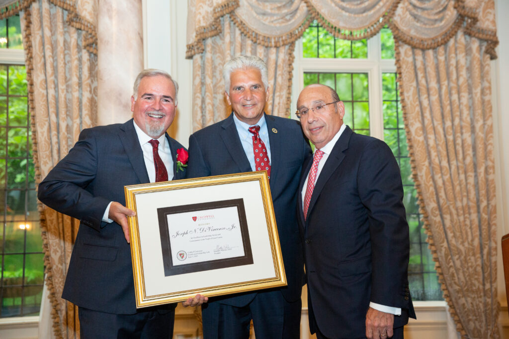 Caldwell University President Matthew Whelan, Ph.D., Essex County Executive Joseph N. DiVincenzo, Jr., and Barry H. Ostrowsky, CEO of RWJBarnabas Health