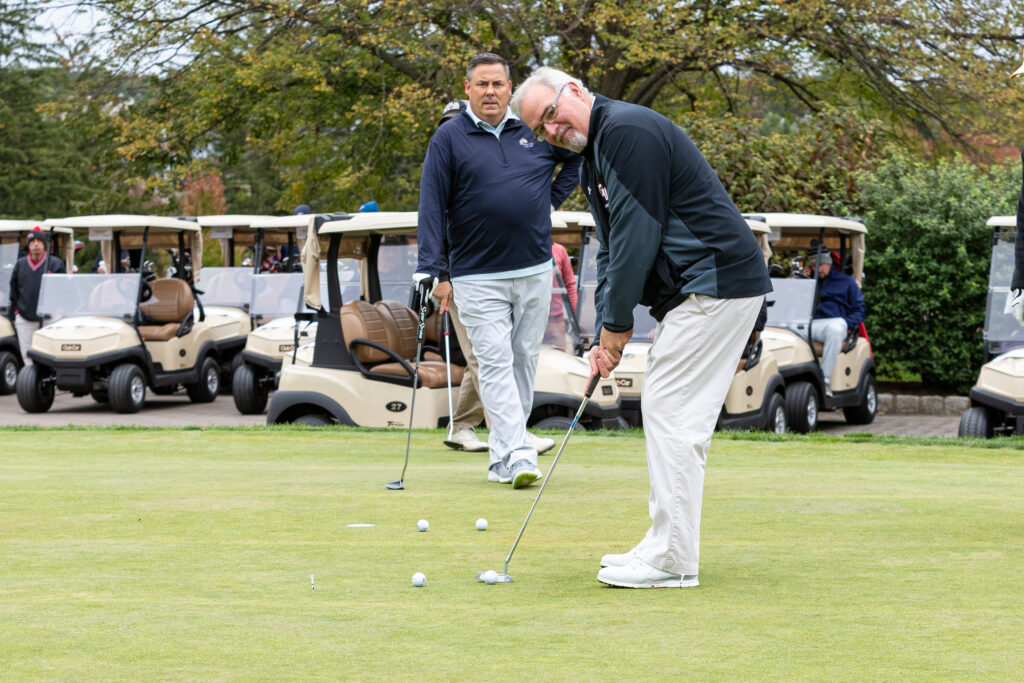 President Whelan playing golf